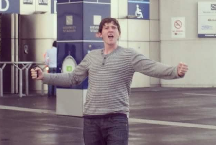 John Maurice Aitken smiling at the camera.